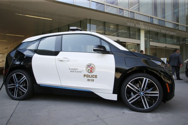 Los Angeles City Mayor Eric Garcetti and Los Angeles Police Department Chief Charlie Beck announce a year long test of a BMW i3 electric vehicle at a City of Los Angeles press conference in Los Angeles, Sept. 11, 2015. Photo by Danny Moloshok/Newscast